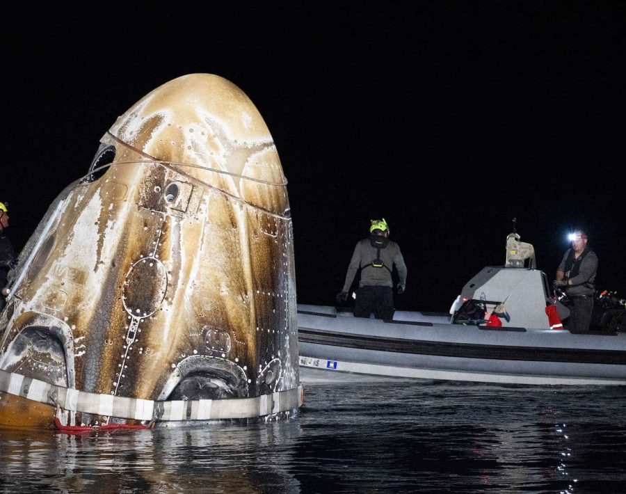 Support teams work around the SpaceX Dragon Endeavour spacecraft shortly after it landed with NASA astronauts Matthew Dominick, Michael Barratt, and Jeanette Epps, and Roscosmos cosmonaut Alexander Grebenkin aboard in the Gulf of Mexico off the coast of Pensacola, Florida, Friday, Oct. 25,2024. Dominick, Barratt, Epps, Grebenkin are returning after seven-months in space as part of Expedition 70 aboard the International Space Station. Photo Credit: (NASA/Joel Kowsky)