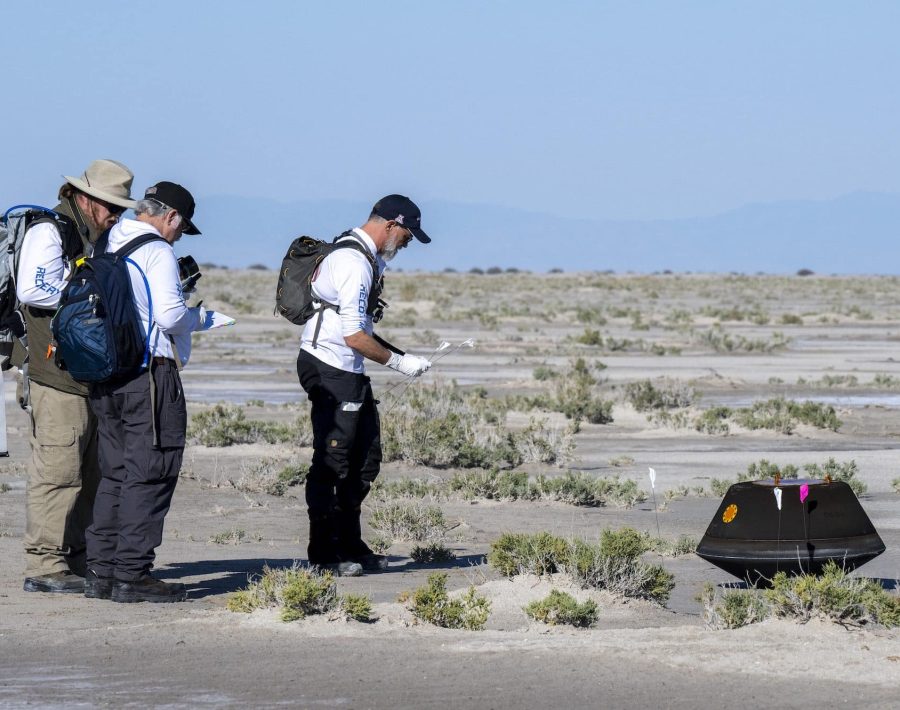 From left to right, NASA Astromatierals Curator Francis McCubbin, NASA Sample Return Capsule Science Lead Scott Sandford, and University of Arizona OSIRIS-REx Principal Investigator Dante Lauretta, collect science data, Sunday, Sept. 24, 2023, shortly after the sample return capsule from NASA’s OSIRIS-REx mission landed at the Department of Defense's Utah Test and Training Range. The sample was collected from the asteroid Bennu in October 2020 by NASA’s OSIRIS-REx spacecraft. Photo Credit: (NASA/Keegan Barber)