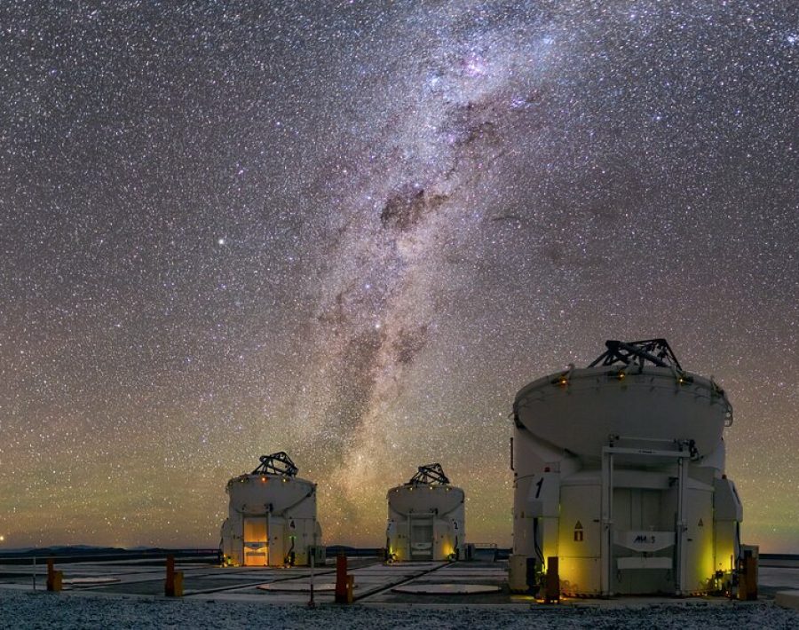 The four Auxiliary Telescopes at ESO’s Paranal Observatory can be seen gazing up to the night sky in this Picture of the Week. With dark and pristine skies, Paranal is one of the best places on Earth to study the universe from. As seen in this spectacular image, the view is really full to the brim of exciting things to look at.  For instance, take a closer look to the right of the Milky Way band, at the two clouds that look like galactic fireworks. These are the Large and Small Magellanic Clouds, dwarf galaxies that are trapped by the gravity of the Milky Way. In the Mapuche language in south-central Chile they are known as lafken, labken or künchalabken (“the lagoons”), and also rünanko (“the water wells”). [1] Peering closer to the horizon we see subtle shades of green and red, but what is it? This is called airglow and is faint light emitted atoms and molecules in the atmosphere. This can happen through various mechanisms, like interaction with solar radiation or chemical reactions between molecules. Green airglow comes from oxygen atoms, whereas the red one is due to both oxygen atoms and hydroxyl molecules. Check this ESO cast to learn more about how airglow is created and why Chile is a particularly good place to see it. Notes [1] Source: Wenumapu. Astronomía y Cosmología Mapuche, Gabriel Pozo Menares & Margarita Canio Llanquinao