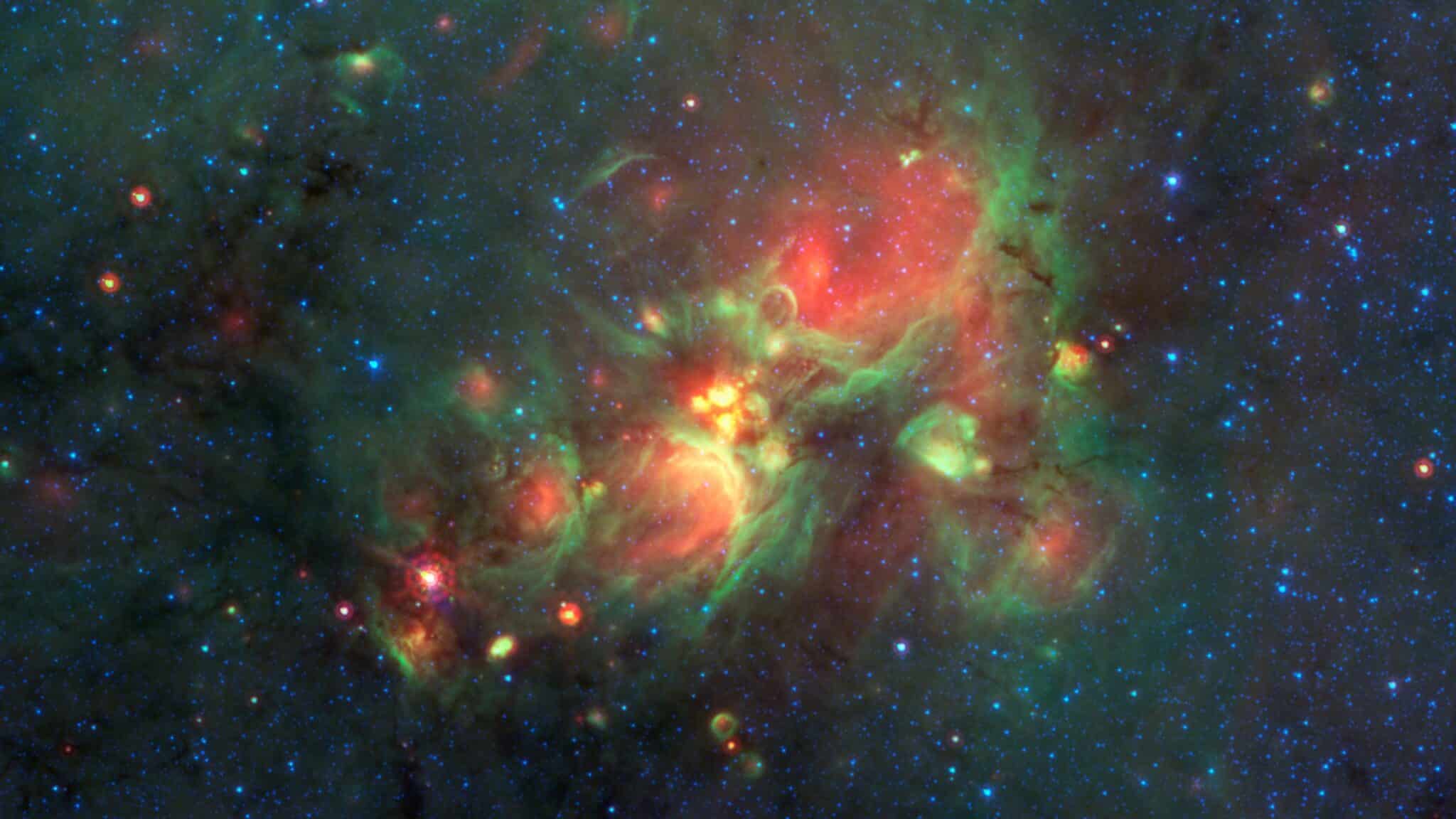 La région de formation d’étoiles W33 située à 13 000 années-lumière dans notre propre galaxie. Crédit : NASA/JPL-Caltech